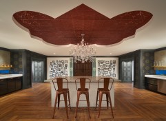 Trustify’s office environment transforms into an atypical workplace upon entry with front-door peepholes that peer into a crime scene rather than their front foyer. The curated frame wall features staff’s family, friends and pets. The pantry area offers adjacent perspectives into accent molded portals toward the contoured hallways and open office space.