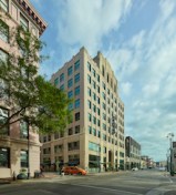 Replicating the original windows' appearance with modern, hurricane code performance, Winco Windows manufactured the replacement units using aluminum framing finished by Linetec in a traditional black color.