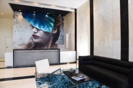 Eve portrait by artist Anna Sweet in the reception area.