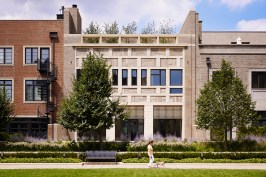The southeast façade, seen here from the shared second-floor park, contains Loewen Windows partially covered with custom sunshades from Navillus Woodworks.
