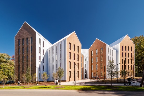The building’s wings are clad in Englert metal siding and roofing, and bookended with façades of Belden Brick.