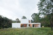 Two volumes create the house’s simple form, seen from the northwest.