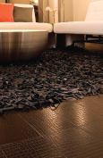 Recycled leather tilesEcoDomowww.ecodomo.com

Uses tanneries' scraps of leather that would otherwise go to landfills



Scraps are shredded and bound using natural rubber and acacia tree bark



Available in eight colors and six textures



Can be used on walls or floors



Exceptional wear and abrasion resistance



Installs like a cork or vinyl floor, but maintains like hardwood