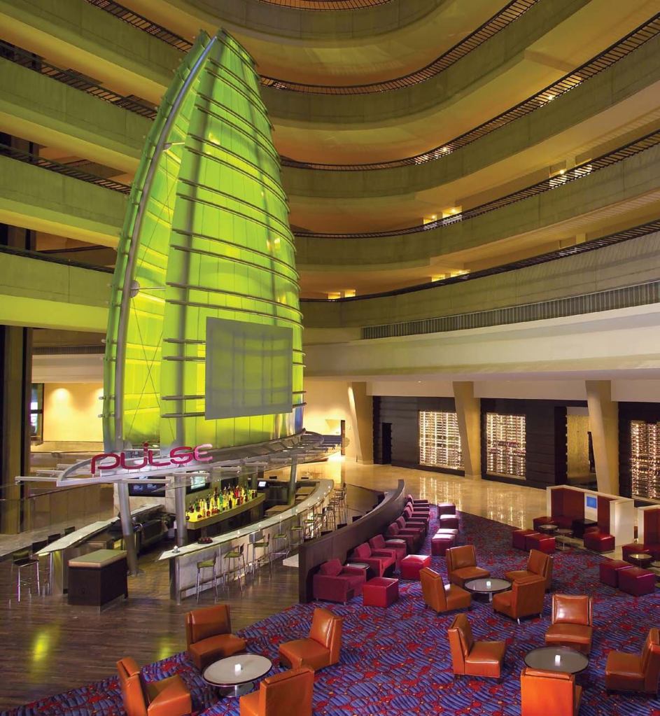 The sail topping the Pulse Bar in the lobby of the Marriot Marquis Hotel in Atlanta is an eye-catching construction of resin panels washed with a series of color-changing fixtures from Martin Architectural Lighting. Able to visually hold its own in the 515-foot-high atrium, the sail gives patrons a light show as they sit in the bar at the end of the day.