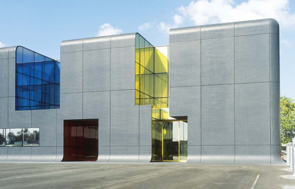 At the regional bus center in the southern Paris area of Thais, custom-molded panels made from fiber-reinforced Ductal concrete form an ultra-thin structural cladding system with a thickness of less than 1 1/4 inches.