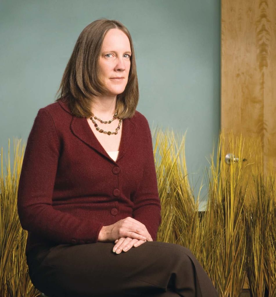 Small steps, big difference: Kristi Ennis, director of sustainable design for Boulder Associates, scrutinizes everything from lightbulbs to garbage pails in her effort to limit the firm’s impact on the environment.