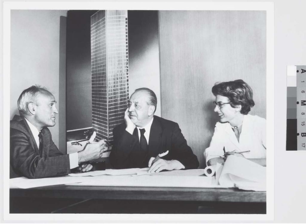 With the Seagram Building, Philip Johnson, Ludwig Mies van der Rohe, and Phyllis Lambert—tastemaker, designer, and benefactor, respectively (shown here, left to right, in 1955)—set the standard for the postwar office tower.
