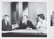 With the Seagram Building, Philip Johnson, Ludwig Mies van der Rohe, and Phyllis Lambert—tastemaker, designer, and benefactor, respectively (shown here, left to right, in 1955)—set the standard for the postwar office tower.