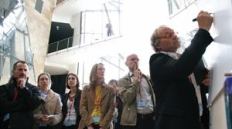 Informal breakout sessions at the Velux Daylighting Symposium in Bilbao, Spain, allowed conference attendees to interact one-on-one with presenters and peers (above).