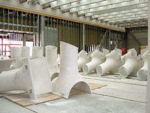 A tubular unit called a "soffitto," constructed of glass-fiber-reinforced gypsum diffuses and directs light into the galleries.