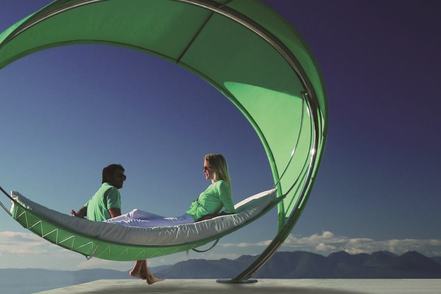 Royal Botania's striking Wave is an elliptical, canopied hammock measuring 12' by 9-1/2' by 8'. Made of electro-polished stainless steel with perforated, semi-transparent fabric, the Wave was designed by Erik Nyber and Gustav Stršm and is suitable for hospitality environments. It rests on one slender support, and the fabric blocks 86% of the sun's rays. royalbotania.com