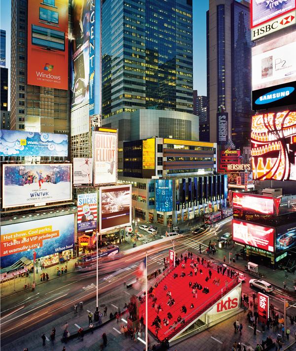 A stage and a backdrop, the new TKTS ticket booth creates a novel urban experience. The laminated glass staircase uses three bands of red LED striplights per tread to create a glowing effect where visitors are simultaneously performers and spectators.