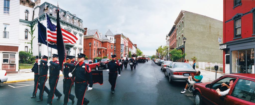 Firefighters parade through Hudson, N.Y., in 2001.