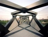 The new Weave Bridge at the University of Pennsylvania creates a pedestrian passage over the Amtrak train tracks that currently separate the main campus from athletic fields along the Schuylkill River.