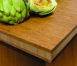 Available in three styles, the new bamboo tabletops and countertops from Teragren provide a sustainable surface for retail and hospitality applications. Strand countertops feature a chestnut face with a vertical-grain core (above), while the End-Grain Strand variety is available in wheat or chestnut with a burl-like pattern. Both Strand options are engineered using Xcora technology, making them 154 percent harder than red oak. The Traditional countertop features a vertical-grain face with a bacteria-resistant, formaldehyde-free surface.

teragren.com