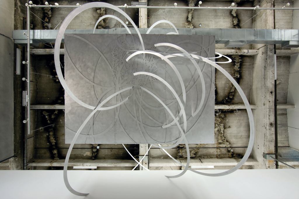 "Architecture needs an enemy," says Eric Owen Moss. The Los Angeles designer nominates the ubiquitous grid and binds it in "If Not Now, When?," an installation on view at SCI-Arc through Sept. 13. Visitors are invited to gather under an aluminum box wrapped by plasma-cut aluminum ribbons and suspended from the ceiling (thanks to engineering consultation from Buro Happold).

sciarc.edu