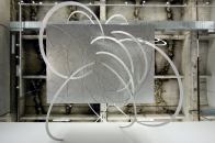 "Architecture needs an enemy," says Eric Owen Moss. The Los Angeles designer nominates the ubiquitous grid and binds it in "If Not Now, When?," an installation on view at SCI-Arc through Sept. 13. Visitors are invited to gather under an aluminum box wrapped by plasma-cut aluminum ribbons and suspended from the ceiling (thanks to engineering consultation from Buro Happold).

sciarc.edu