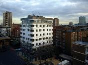 The patterning of the tiles on the exterior of the building is based on play of shadows on the site from surrounding buildings and trees. The tiles are a fake slate product that uses wood pulp as one of the main ingredients. Ceramic tiles, Anthony Thistleton notes, would have used as much carbon to fire as the project saved by using the cross-laminated timber that holds the building together.