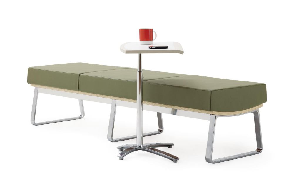 The Truman collection from Harter by Izzy includes a bench, lounge, and occasional table. The bench (shown) has a die-cast aluminum frame with 20% post-consumer content, a recyclable molded plywood seat base, and a manufactured urethane cushion. It comes in 24", 48", or 72" lengths and myriad upholstery options. ¢ izzyplus.com