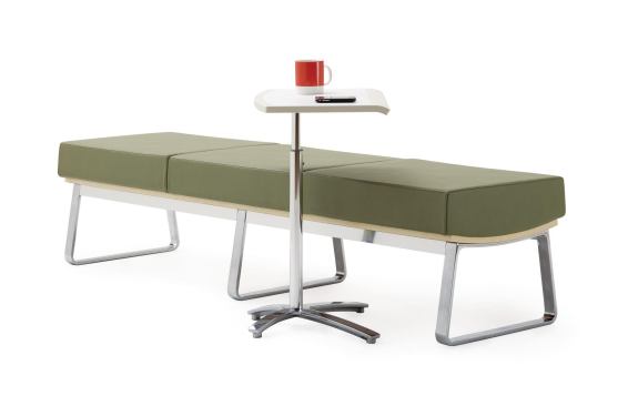 The Truman collection from Harter by Izzy includes a bench, lounge, and occasional table. The bench (shown) has a die-cast aluminum frame with 20% post-consumer content, a recyclable molded plywood seat base, and a manufactured urethane cushion. It comes in 24", 48", or 72" lengths and myriad upholstery options. ¢ izzyplus.com