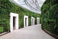 Part of Longwood Gardens' new East Conservatory Plaza, the green wall lines a covered walkway leading from the conservatory and housing eco-friendly public restrooms.