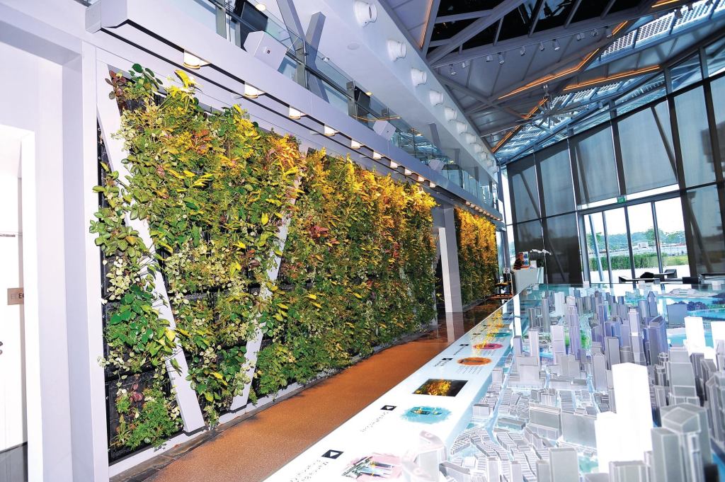 Elmich green walls utilize a Vertical Greening Module (VGM), which is assembled from high-strength lightweight plastic. Modules are 20" by 22" and up to 10" deep. Each VGM contains a geotextile liner placed in a mostly inorganic planting mix. The living walls reduce sound transmission, enhance air quality, and reduce stormwater runoff. ¢ elmich.com