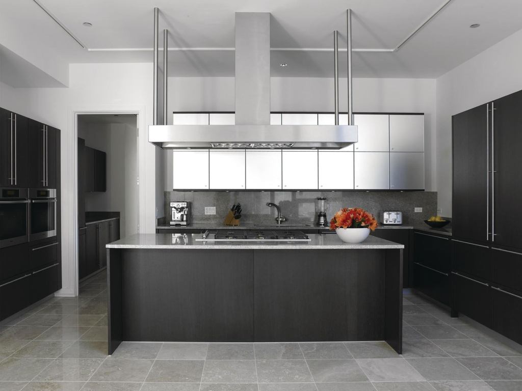 Abbaka’s slim Uni-Form range hood has a 6"-tall canopy that houses an exhaust ventilator available in 800, 1,000, 1,200, and 1,400 cubic feet per minute power options. The hood comes in seven standard sizes, from 42" to 78" wide, with custom sizes also available. An in-hood commercial baffle filter system meets the demands of restaurant-grade ranges, while a variable-speed fan provides control, and mini halogen lamps offer task lighting. Available in wall-mount or island versions. abbaka.com