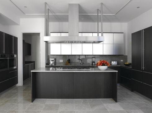 Abbaka’s slim Uni-Form range hood has a 6"-tall canopy that houses an exhaust ventilator available in 800, 1,000, 1,200, and 1,400 cubic feet per minute power options. The hood comes in seven standard sizes, from 42" to 78" wide, with custom sizes also available. An in-hood commercial baffle filter system meets the demands of restaurant-grade ranges, while a variable-speed fan provides control, and mini halogen lamps offer task lighting. Available in wall-mount or island versions. abbaka.com