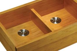 Lenovas first undermounted Bamboo Apron Front Kitchen Sink has an equal doublebowl design and is made of fully matured Moso bamboochosen for its density color and sustainabilitywith SGScertified safe binding adhesives and a waterresistant topcoat. A lowrise divider provides versatility while accommodating larger cookware items. The sink measures 3234" by 21" by 9".  lenovasinks.com