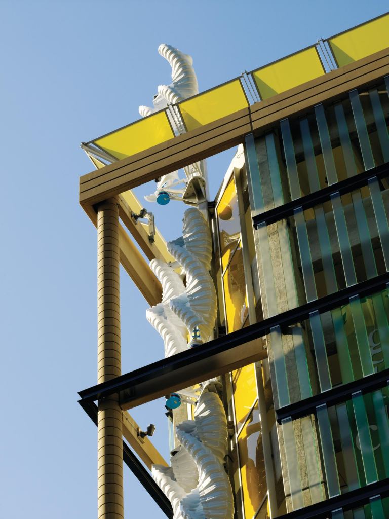 The benefit of vertical-axis wind turbines, such as those in Chicago's Greenway Self Park (above), is that they make use of breezes coming from any direction, and at a variety of speeds. By chamfering the parking garage corner where the 12 turbines are, HOK increased the turbines' exposure to Second City winds.