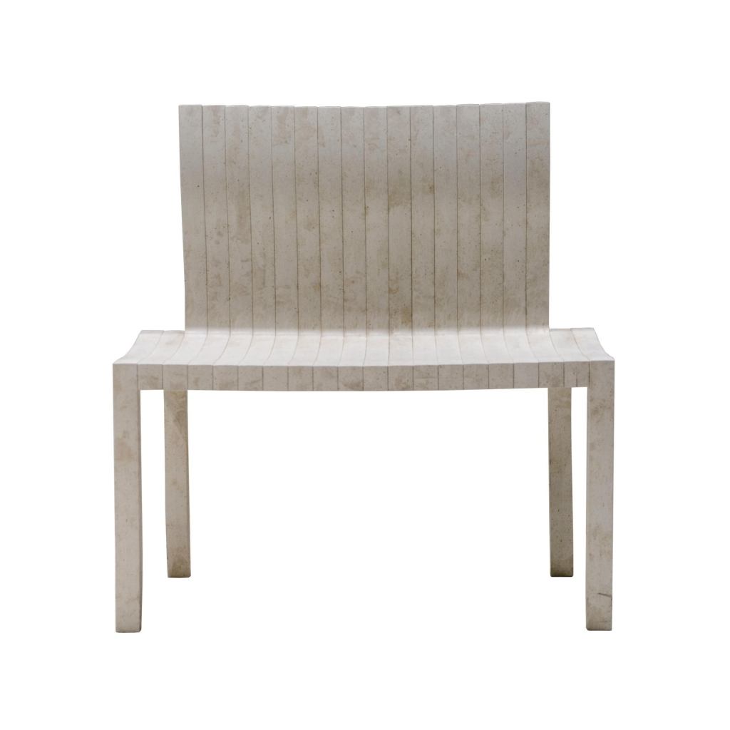 Created by Japanese architect Shigeru Ban for Artek, the modular 10-Unit System is based on L-shaped units that can be combined in different ways to make a chair, a table, or a bench. The chair and table each require 10 units, while the bench requires 20. Made of UPM ProFi, a wood-plastic composite of recycled paper and plastic, the furniture can be disposed of by incineration. Black and white are the standard colors; the chair measures 33" tall, 16" wide, and 17" deep, while the table is 27-1/2" square. The bench is 33" high and 31" wide. artek.fi