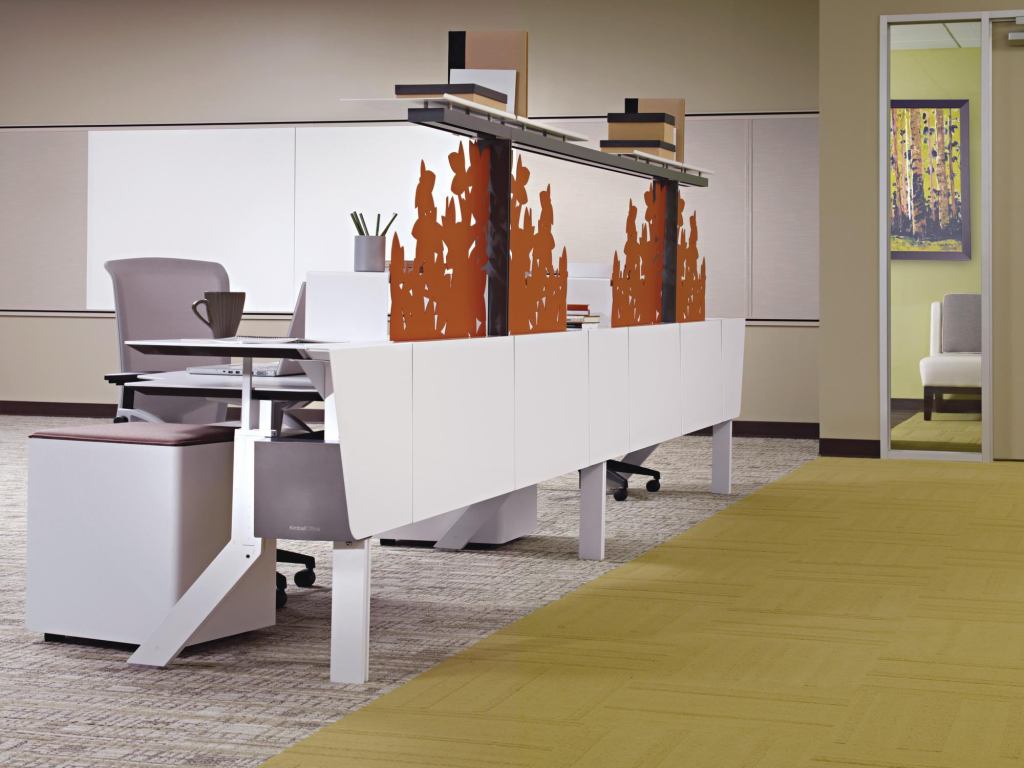 Kimball Office has added a one-sided station to its Hum. Minds at Work. line. The One-Sided Solution can form walkways between workstations, and it provides both a personal and collaborative workspace with a height-adjustable, convex table top, as well as terraces for personalized organizing and prioritizing. The lines See Me screens, or central screens, are available to divide space, as can undersurface-mounted modesty screens. The screens come in 15 colors. The line reflects personal work styles and encourages multiuse spaces in order to switch from individual focus to collaboration easily. The line includes multiple cluster sizes as well as stand-alone work stations. kimballoffice.com