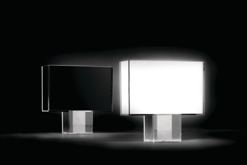 Tati, a new line of table lamps from Kartell, features a squared-off Art Decostyle shape. A transparent polycarbonate body encases an internal diffuser available in full-color methacrylate, opaline, and black or in pleated fabric. A chrome steel weight offers additional support. Its light intensity is fully adjustable. Tati is lamped with a 22W T5 ring and measures 47" wide by 46" tall by 15" deep. It was designed by Ferruccio Laviani. kartell.com