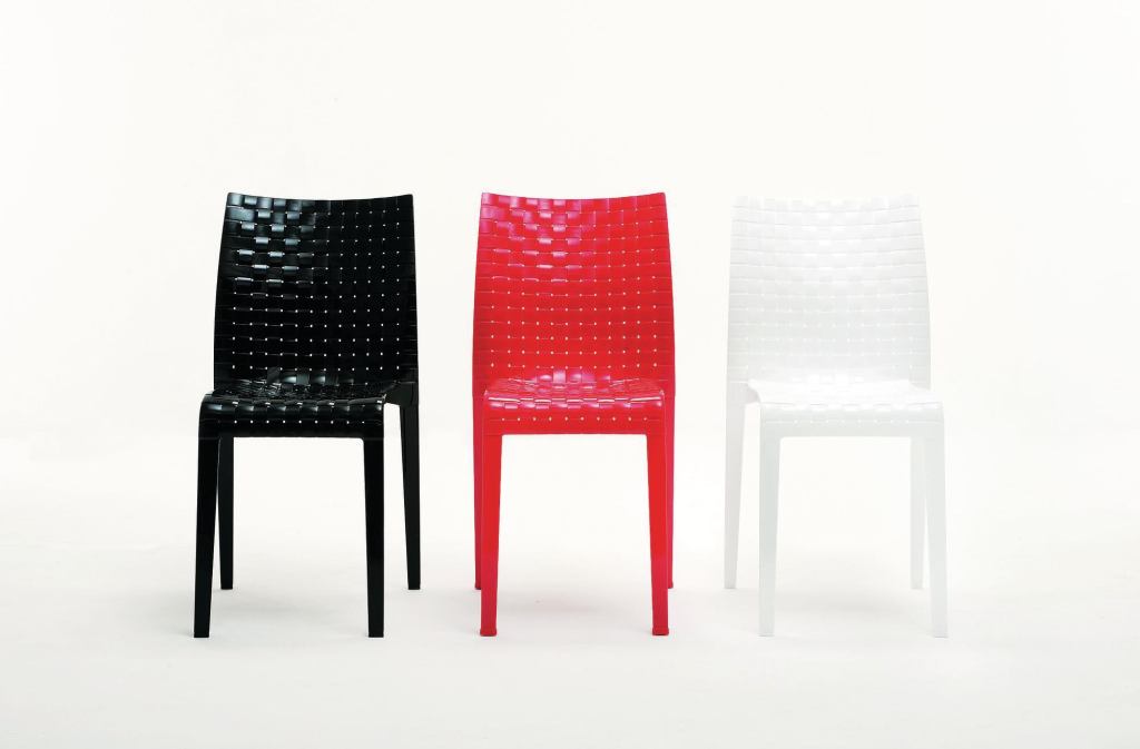 Ami Ami from Kartell is a table and chair created by Japanese designer Tokujin Yoshioka. Meant to recall traditional Japanese interlaced patterns, Ami Ami creates an optical illusion that mimics the warp and weft of fabric. The line is available in clear or smoked transparent versions, as well as in a series of glossy saturated colors including black, white, and red. The chair is stackable and made out of polycarbonate, and the table has a 27-1/2"-square polycarbonate top with aluminum legs. The chair is 16" wide, 33" tall, and 19-1/2" deep. kartell.com