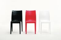 Ami Ami from Kartell is a table and chair created by Japanese designer Tokujin Yoshioka. Meant to recall traditional Japanese interlaced patterns, Ami Ami creates an optical illusion that mimics the warp and weft of fabric. The line is available in clear or smoked transparent versions, as well as in a series of glossy saturated colors including black, white, and red. The chair is stackable and made out of polycarbonate, and the table has a 27-1/2"-square polycarbonate top with aluminum legs. The chair is 16" wide, 33" tall, and 19-1/2" deep. kartell.com