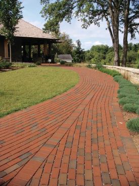 Pine Hall Bricks StormPave allows rainwater to filter down through a specially constructed paving system and to dissipate into soil instead of going in to storm drains. Designed to look like traditional English Edge pavers but with larger spacer nibs, the permeable pavers are suited for institutional and commercial projects where impervious surface restrictions apply and joint openings need to meet ADA restrictions (less than 1/2") when on-site retention or infiltration is mandated. The pavers are available in red and full color. Other colors may be available upon request. pinehallbrick.com