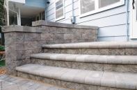 Versa-Lok top-pinning segmental retaining wall system is now available in a bronze blend color. The concrete system is finished in either a traditional split-face or a vintage weathered texture and readily accommodates soil reinforcement to build walls 50' or taller. It can be used to build walls, curves, multi-angle corners, stairs, and freestanding walls and columns. No specialty pieces are required, and no hollow cores are created to be filled. Versa-Lok is available in several options, including Standard, Cobble, Accent, random-pattern Mosaic, Mosette, Brute, Bronco, Square Foot, and Versa-Green (which is plantable). versa-lok.com