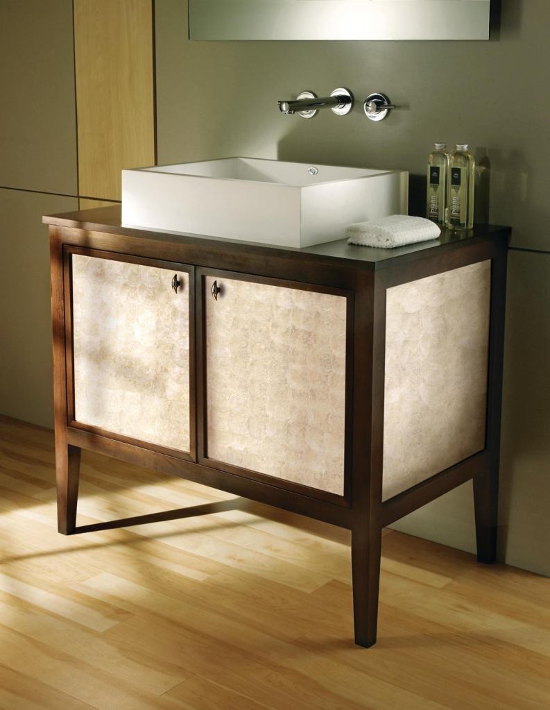 MTIWhirlpools Transitional line of bath furniture is able to complement both contemporary and traditional bath fixtures. Made with FSC-certified hardwoods, the line is low-VOC and low-HAP. ¨They are available with optional hardwood tops, and each piece is customizable from interior and exterior finishes to decorative front panels that include linen, exotic zebrawood, and antique mirror. Drawers include dovetail-joined construction, and doors and drawers feature soft-close hardware.The vanity shown includes an Aphrodite shell design from wallcovering manufacturer Maya Romanoff and a tropical veneer. mtiwhirlpools.com
