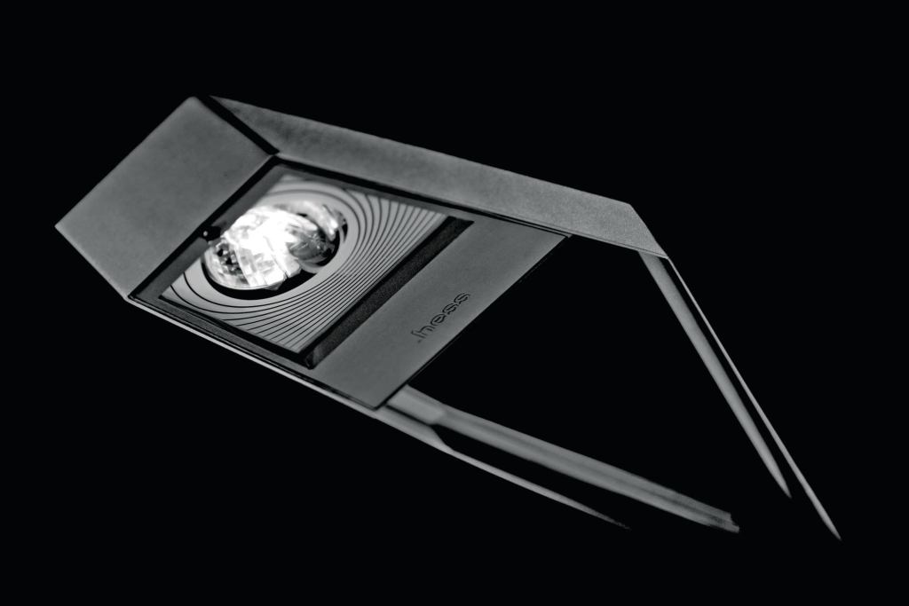 HessAmericas Pasadena is a pole-mounted luminaire for pedestrian-scale area and street lighting applications. Suitable for everything from universities to parks to corporate campuses, Pasadena has a low-profile cast-aluminum housing and a tempered glass lens with screen-printed motif. Full cutoff performances makes it suited for dark sky applications and eligible for LEED points. Lamping options include 70W to 150W ceramic metal halide or 60W to 140W Cosmopolis ceramic metal halide. Electronic ballasts provide maximum efficiency, and mounting may be single or twin configurations. Standard finishes include silver gray metallic, dark gray, or graphite gray. hessamerica.com