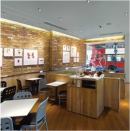 In the newly designed prototype for sandwich chain Pret A Manger, light rings the perimeter of the store and creates a visible focal point from the street to draw customers inside. A combination of fluorescent and LED sources offer color-temperature variability to respond to different lighting conditions throughout the day.