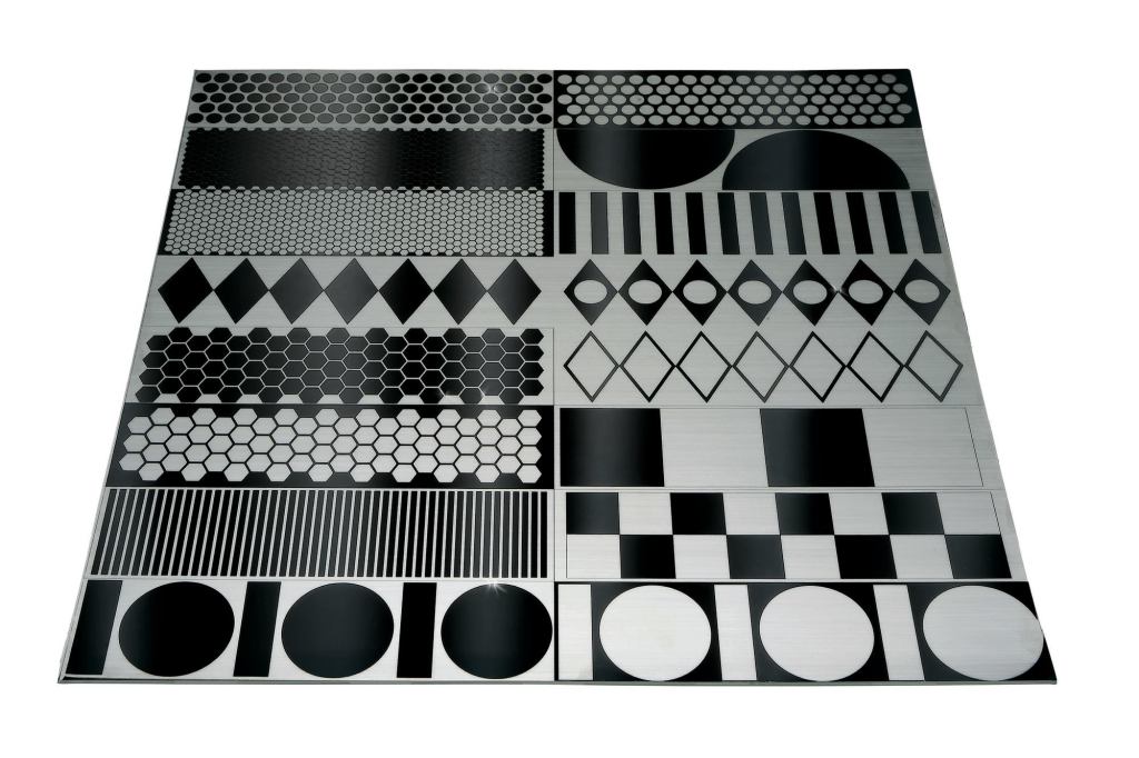 Lasertrons etched stainless steel backsplashes start as a single piece of mirror-finish stainless steel. During the manufacturing process, pattern outlines are masked and the exposed area is brushed with an abrasive. No toxic chemicals are used. Geometric patterns include squares, circles, and diamonds. Panel sizes can be made up to 48" by 96". ¢ lasertrondirect.com
