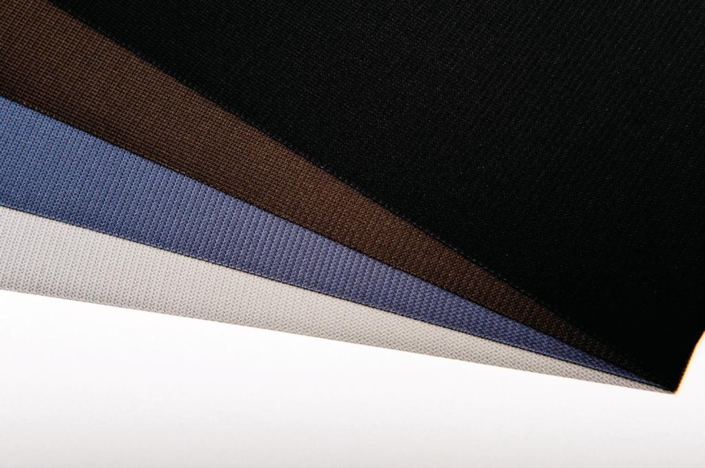 Nysan Solar Control has released GreenScreen DuoTone fabric. The two-tone fabric is available in four color options and allows architects to control heat gain. A light color on the exterior reflects heat and, though it appears opaque from the outside, a darker interior surface allows for outward views. The recyclable, PVC-free fabric is made of 92% polyester yarn and 8% polyurethane finish. ¢ nysan.com