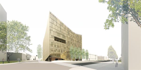 A shingled skin wraps the original building, pulling up at the base to create a more dynamic entry sequence than existed previously. The move reorients the external circulation and engages with the surrounding campus streets and buildings.