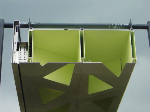 Laser-cutting, welding, bolting, and pre-cambering produced a mass customized steel roof that is 50 cm (nearly 20 inches) deep.