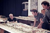 Frank Gehry, Mark Zuckerberg, and Everett Katigbak look over plans for the Menlo Park headquarters expansion.