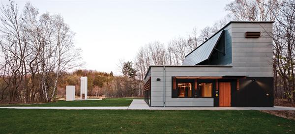 The building was designed with Passivhaus principles, with heating primarily by direct passive solar gain from the south, and internal heat gain from equipment and occupants.