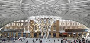 The glass, steel, and aluminum diagrid roof of the new Western Concourse at King?s Cross station spans out from a central woven funnel.