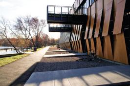 The architects strove to design a boathouse that would conserve energy and natural resources and have low operating costs. Their solution: an active building-envelope system, created using digital design tools and in close collaboration with fabricators and other consultants. Made of aluminum frames and composite panels, the prefabricated system has vents that open with a tug on an off-the-shelf chain pull. These vents not only create an active facade; they eliminate the need for mechanical heating and cooling of the 300-foot-long boat storage bays.