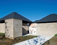 Restored bath house with recreated entry mural.
