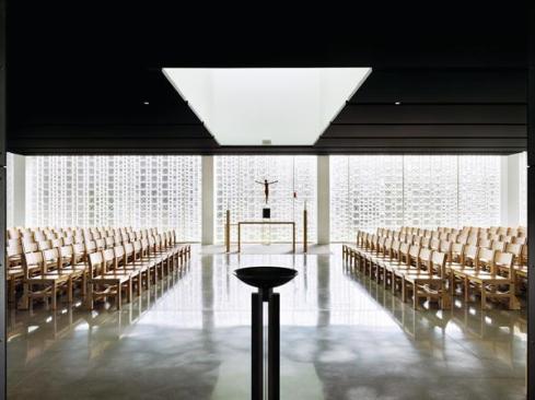 The Chapel of St. Ignatius of Loyola at Christ the King Jesuit College Preparatory School in Chicago is illuminated by the natural light that filters through three walls of varying-sized glass block.